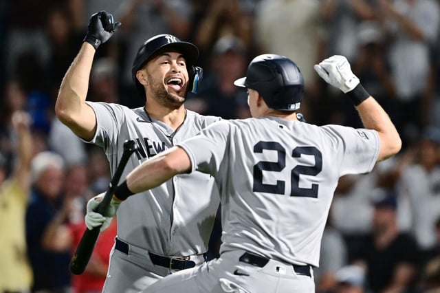 TAMPA, FLORIDA - AUGUST 19: Giancarlo Stanton #27 celebrates with Ben Rice #22 of the New York Yankees after hitting a home run in the first inning against the New York Yankees at George M. Steinbrenner Field on August 19, 2025 in Tampa, Florida. (Photo by Julio Aguilar/Getty Images)
