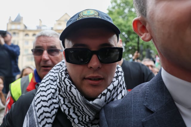 Liam Óg Ó hAnnaidh, who performs as Mo Chara, arrives at the Westminster Magistrates' Court in London on Wednesday.