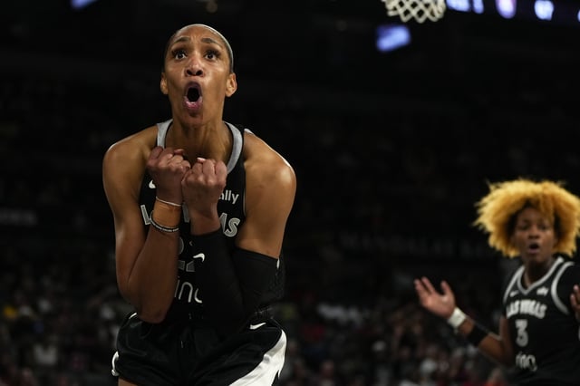 Aug 19, 2025; Las Vegas, Nevada, USA; Las Vegas Aces center A'ja Wilson (22) reacts to a foul call during the second half of a WNBA basketball game against the Atlanta Dream at Michelob Ultra Arena. Mandatory Credit: Lucas Peltier-Imagn Images