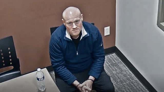 Christopher Thomas being interrogated