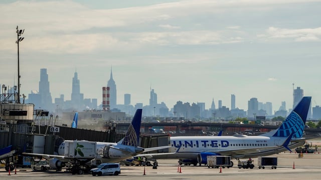 A view shows United Airlines planes at the tarmac at Newark International Airport, as the skyline of New York is seen in the background from Newark, New Jersey, U.S., May 7, 2025. REUTERS/Eduardo Munoz