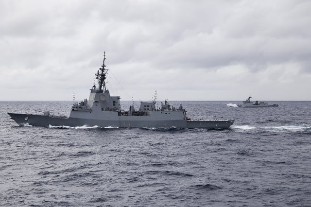 Hobart-class guided missile destroyer the HMAS Brisbane joins Philippine guided missile frigate the BRP Rizal for joint training during Exercise Alon 25 in the South China Sea on August 19, 2025.