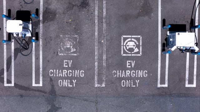 An electric vehicle charging location is shown from the view of a drone in Carlsbad, California, U.S., May 14, 2025. REUTERS/Mike Blake/File Photo