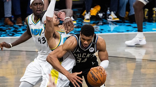 Apr 29, 2025; Indianapolis, Indiana, USA; Milwaukee Bucks forward Giannis Antetokounmpo (34) dribbles the ball while Indiana Pacers guard Andrew Nembhard (2) defends during game five of the first round for the 2024 NBA Playoffs at Gainbridge Fieldhouse. Mandatory Credit: Trevor Ruszkowski-Imagn Images