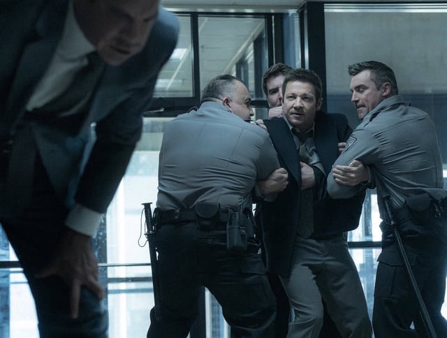 L-R: Clayton Cardenas as Torres and Jeremy Renner as Mike McLusky in Mayor of Kingstown season 4, streaming on Paramount+, 2025. Credit: Dennis P. Mong Jr./Paramount+   ©2025 Viacom International Inc. All Rights Reserved. Mayor of Kingstown and all related titles, logos and characters are trademarks of Viacom International Inc.