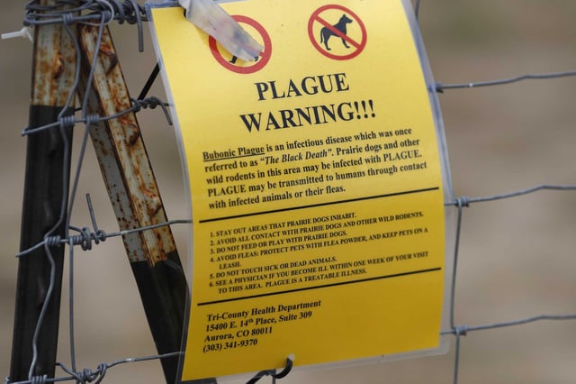 A bubonic plague warning sign is displayed at a parking lot near the Rocky Mountain Arsenal Wildlife Refuge, Saturday, Aug. 10, 2019, in Commerce City, Colo. A South Lake Tahoe resident has tested positive for plague, health officials confirmed this week — the first reported human case in El Dorado County since 2020.