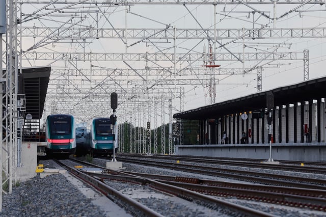 A Maya Train car, center, sits derailed at a station in Izamal, Yucatan state, Mexico, Tuesday, Aug. 19, 2025. (AP Photo/Martin Zetina)