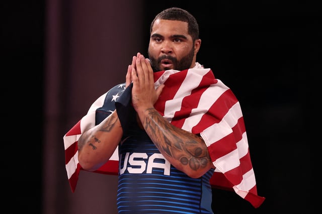 USA's Gable Dan Steveson celebrates his gold medal victory against Georgia's Geno Petriashvili in their men's freestyle 125kg wrestling final match during the Tokyo 2020 Olympic Games at the Makuhari Messe in Tokyo on August 6, 2021.