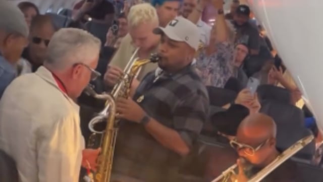 jazz artists play on plane during delay
