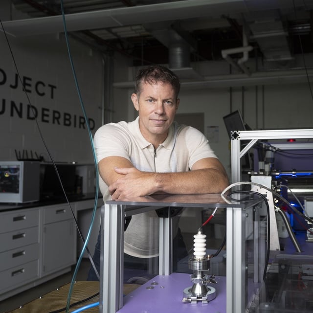 Curtis Berlinguette, principal investigator of Berlinguette Research, stands inside one of his program’s labs on the UBC campus in Vancouver on Tuesday. Behind him is a reactor part of Project Thunderbird.