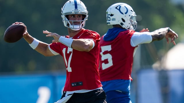 Indianapolis Colts quarterbacks Anthony Richardson Sr. (5) and Daniel Jones (17) pass Wednesday, July 23, 2025, during the first day of training camp held at Grand Park in Westfield. Mykal McEldowney/IndyStar / USA TODAY NETWORK via Imagn Images