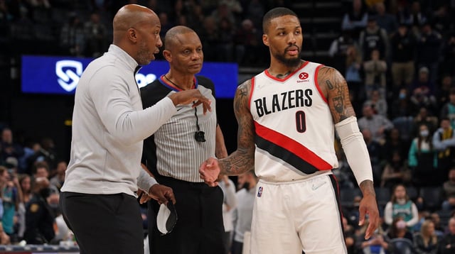Dec 19, 2021; Memphis, Tennessee, USA; Portland Trail Blazers head coach Chauncey Billups talks with Portland Trail Blazers guard Damian Lillard (0) after a foul call during the fourth quarter against the Memphis Grizzles at FedExForum. Mandatory Credit: Petre Thomas-Imagn Images
