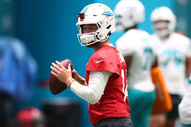 MIAMI GARDENS, FLORIDA - JULY 23: Quinn Ewers #14 of the Miami Dolphins looks to pass during Miami Dolphins Training Camp at Baptist Health Training Complex on July 23, 2025 in Miami Gardens, Florida.