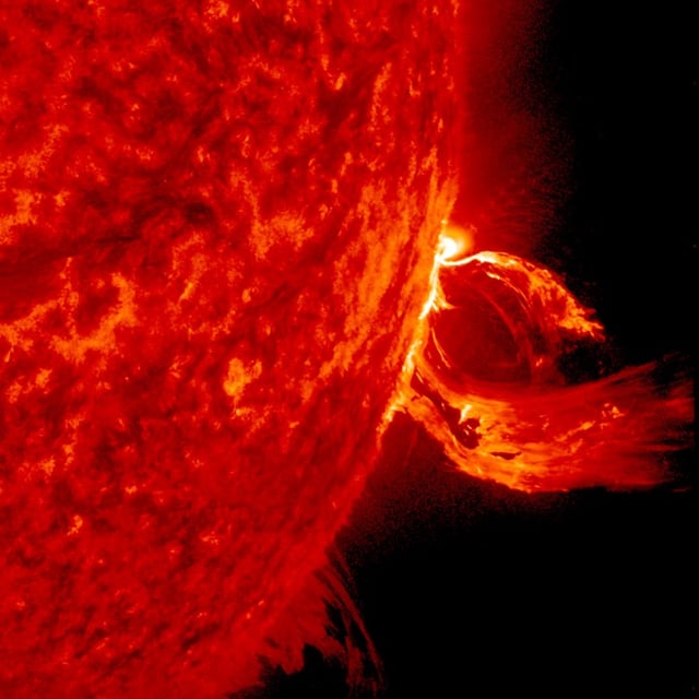 A substantial coronal mass ejection, or CME, blows out from the side of the Sun, giving us a great view of the event in profile on June 17–18, 2015. NASA's Solar Dynamics Observatory caught the action in the 304-angstrom wavelength of extreme ultraviolet light. The video clip covers about four hours of the event. While some of the plasma falls back into the Sun, a look at the coronagraph on SOHO shows a large cloud of particles heading into space. Credit: NASA/Goddard/SDO