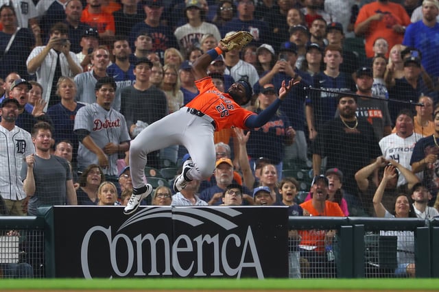 Taylor Trammell #26 of the Houston Astros makes a 9th inning ending catch on a foul ball while playing the Detroit Tigers at Comerica Park on August 19, 2025 in Detroit, Michigan.