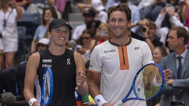 Iga Swiatek and Casper Ruud at mixed doubles match at the U.S. Open in New York. (AP)
