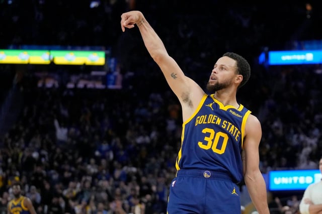 Golden State Warriors guard Stephen Curry (30) gestures during an NBA basketball game against the Oklahoma City Thunder in San Francisco, Saturday, Nov. 18, 2023. All-Star Saturday Night, Feb. 17, 2024, gets an event like never before: Sabrina Ionescu vs. Stephen Curry, in a 3-point battle of the sexes.(AP Photo/Jeff Chiu, File)