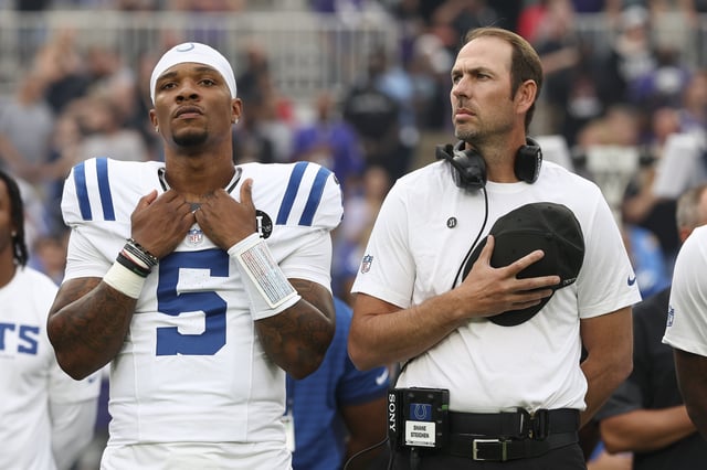 Anthony Richardson Sr. #5 of the Indianapolis Colts and head coach Shane Steichen stand for the national anthem prior to an NFL Preseason 2025 game against the Baltimore Ravens at M&T Bank Stadium on August 7, 2025 in Baltimore, Maryland.