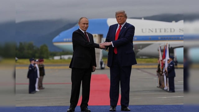 President Donald Trump greets Russia's President Vladimir Putin Friday, Aug. 15,...