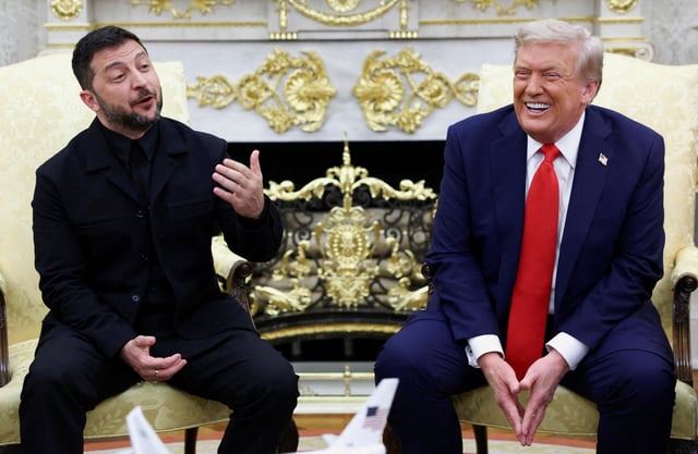 Ukrainian President Volodymyr Zelenskiy gestures as U.S. President Donald Trump reacts during a meeting at the Oval Office of the White House, amid negotiations to end the Russian war in Ukraine, in Washington, D.C., U.S., August 18, 2025. REUTERS/Kevin Lamarque/File Photo