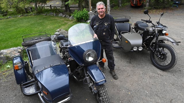 Alaska resident Mark Warren poses with a new Ural motorcycle he received as a gift from the Russian government in Anchorage, Alaska, Monday, Aug. 18, 2025, after Russian President Vladimir Putin's visit to the state for a summit meeting with U.S. President Trump.