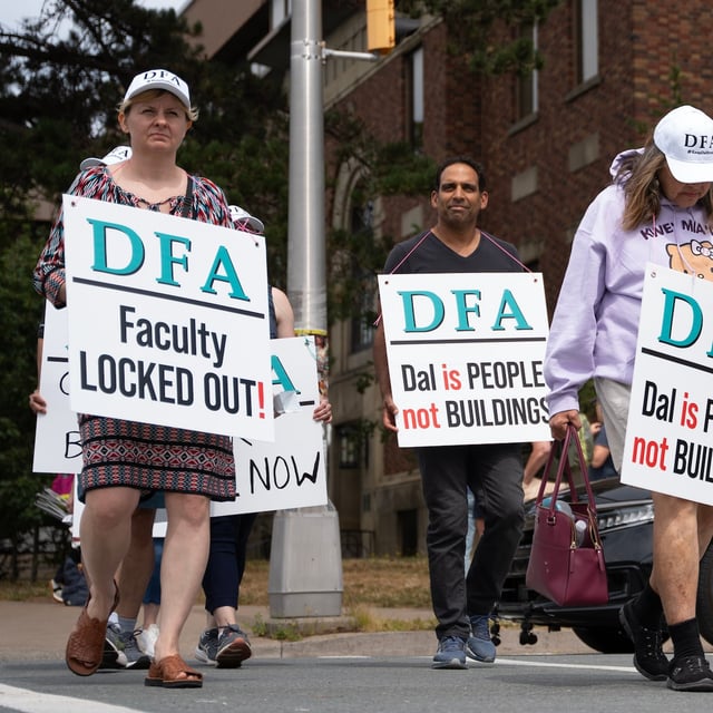Members of the Dalhousie Faculty Association walk a picket line after the university locked members out over a contract dispute in Halifax on Wednesday, Aug. 20, 2025. THE CANADIAN PRESS/Darren Calabrese