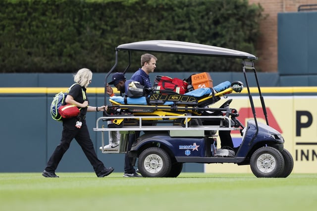Aug 20, 2025; Detroit, Michigan, USA;  Houston Astros outfielder Taylor Trammell (center) is carted off the field after he is injured in the first inning against the Detroit Tigers at Comerica Park. Mandatory Credit: Rick Osentoski-Imagn Images