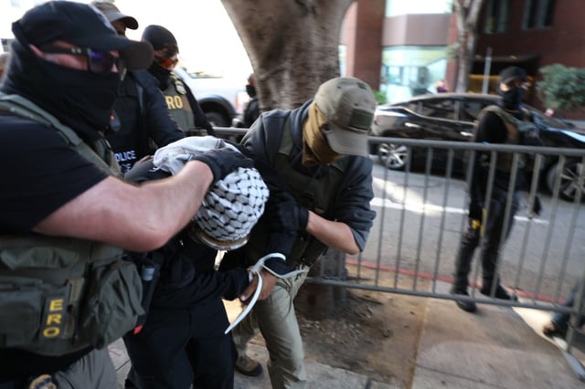 ICE agents arresting a protester in downtown San Francisco at what have become common anti-ICE actions, on Aug. 20, 2025. Photo by Tyler Morris.