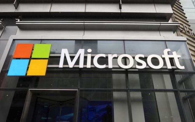 NEW YORK, NY - APRIL 29: A Microsoft corporate logo hangs on the side of their office building on Eighth Avenue on April 29, 2023, in New York City. (Photo by Gary Hershorn/Getty Images)
