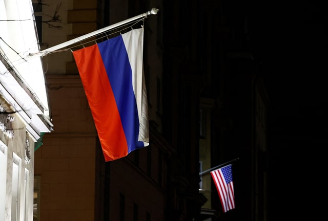 A view shows the Russian flag on the facade of a historic building alongside the American flag on the facade of the U.S. Embassy in Moscow, Russia March 18, 2025. REUTERS/Yulia Morozova/File photo