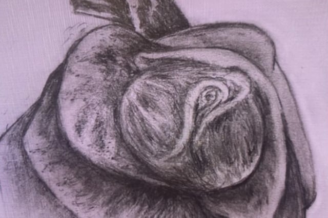 Police say the remains of a person found near the Jackie Robinson Parkway had this tattoo on her buttocks.