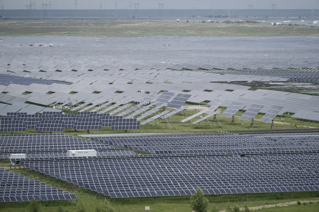 A solar farm is visible in Hainan prefecture of western China's Qinghai province on Tuesday, July 1, 2025. (AP Photo/Ng Han Guan)