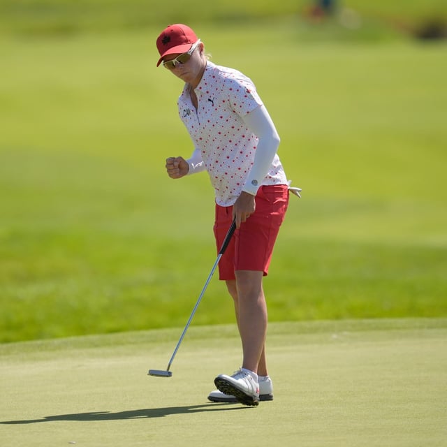 Alena Sharp, of Canada, reacts after putting on the 9th green during the final round of the women's golf event at the 2024 Summer Olympics, Saturday, Aug. 10, 2024, at Le Golf National, in Saint-Quentin-en-Yvelines, France. (AP Photo/George Walker IV)