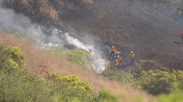 Fire crews battle the Beacon Fire in Laguna Niguel on Wednesday, Aug. 20, 2025.