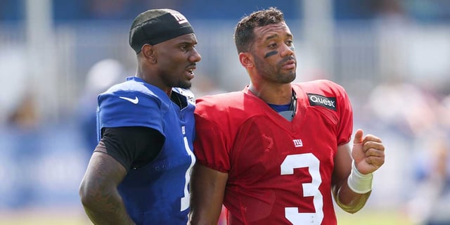 Aug 4, 2025; East Rutherford, NJ, USA; New York Giants wide receiver Malik Nabers (1) talks with quarterback Russell Wilson (3) during training camp at Quest Diagnostics Training Center. Mandatory Credit: Vincent Carchietta-Imagn Images