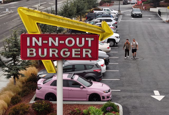An aerial view of a sign in front of an In-N-Out Burger restaurant on July 21, 2025 in Daly City, California.