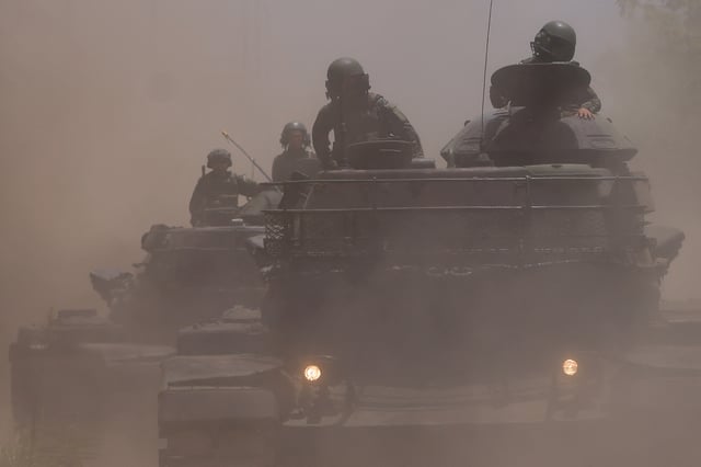 A view of soldiers on top of M60A3 tanks during a drill rehearsal in New Taipei City, Taiwan July 20, 2023. REUTERS/Ann Wang/File Photo