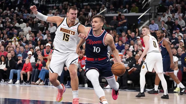 May 1, 2025; Inglewood, California, USA; LA Clippers guard Bogdan Bogdanovic (10) dribbles the ball against Denver Nuggets center Nikola Jokic (15) in the second half during game six of first round for the 2025 NBA Playoffs at Intuit Dome. Mandatory Credit: Kirby Lee-Imagn Images