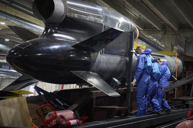 Workers inspect a Flamingo cruise missile at Fire Point's secret factory in Ukraine on Monday, Aug. 18, 2025. (AP Photo/Efrem Lukatsky)