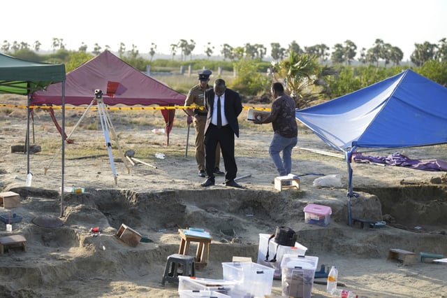 Magistrate Amalavalan Anandarajah, center, inspects a mass grave site in Chemmani, Sri Lanka, Aug. 5, 2025. (AP Photo/Eranga Jayawardena)
