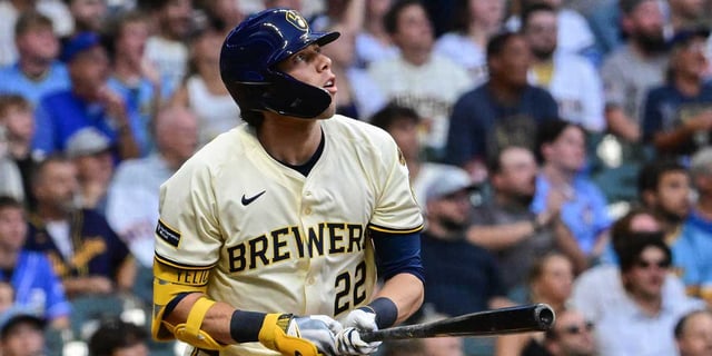 Aug 11, 2025; Milwaukee, Wisconsin, USA; Milwaukee Brewers designated hitter Christian Yelich (22) hits a solo home run in the third inning against the Pittsburgh Pirates at American Family Field. Mandatory Credit: Benny Sieu-Imagn Images.