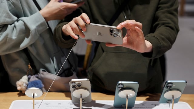 A man checks an iPhone 16 Pro Max as the new iPhone 16 series smartphones go on sale at an Apple store in Beijing, China September 20, 2024. REUTERS//File Photo