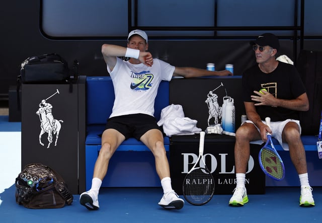 Tennis - Australian Open - Practice - Melbourne Park, Melbourne, Australia - January 10, 2025 Italy's Jannik Sinner with coach Darren Cahill during a practice session ahead of the Australian Open REUTERS/Tingshu Wang/File Photo