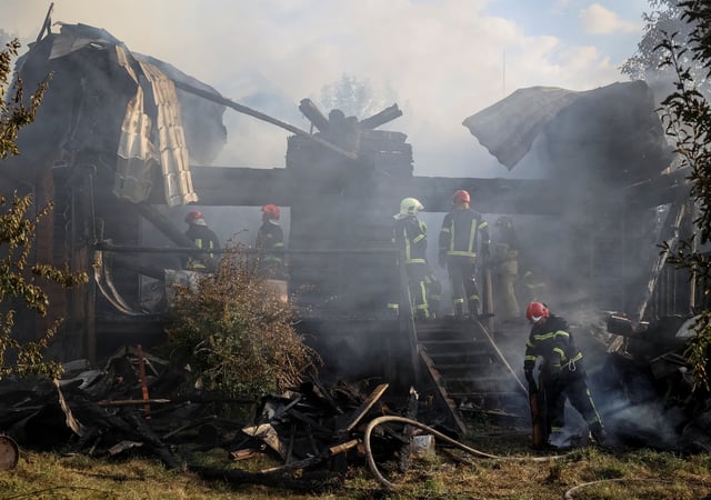 Firefighters work at the site of the Russian missile strike, amid Russia's attack on Ukraine, in the village of Sknyliv on the outskirts of Lviv, Ukraine August 21, 2025. REUTERS/Roman Baluk
