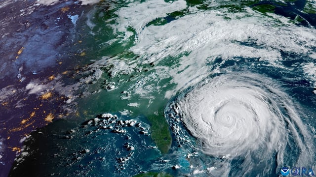 Hurricane Erin, classified as a Category 2 storm with 110 mph winds, is impacting the East Coast. (Photo by Handout / NOAA / AFP) 