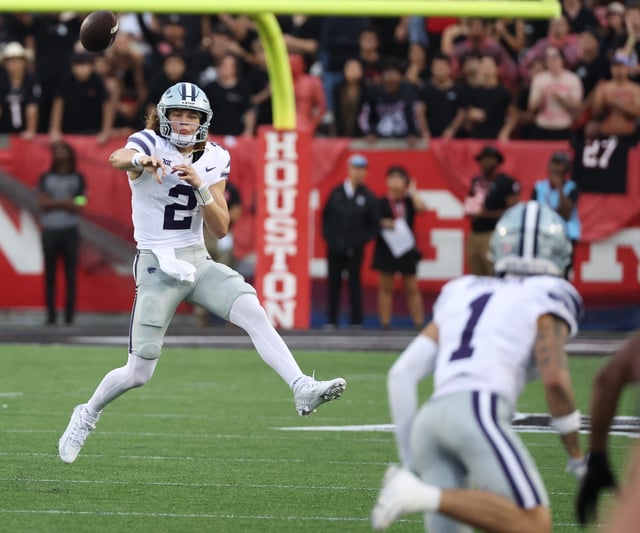 Nov 2, 2024; Houston, Texas, USA;Kansas State Wildcats quarterback Avery Johnson (2) completes a pass to wide receiver Jayce Brown (1) against the Houston Cougars in the second quarter at TDECU Stadium. Mandatory Credit: Thomas B. Shea-Imagn Images
