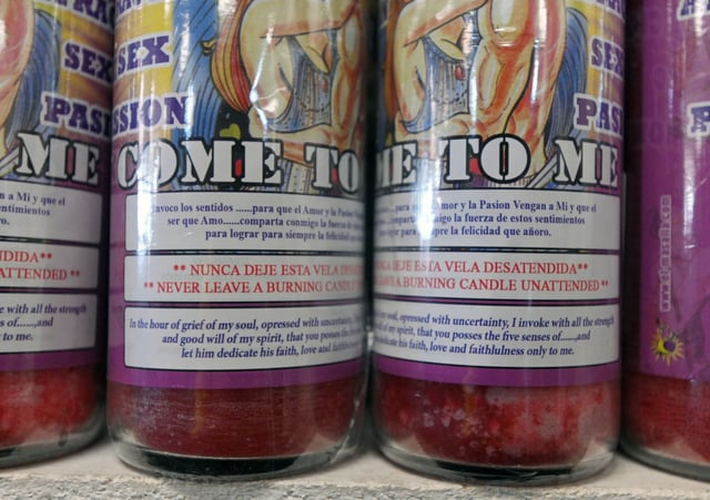 Direction or “spell” is printed on scented “Love” candles for sale at the Crystal Fox store in Laruel. LaTonja Carrera used COVID relief funds to shop at this store and purchased similar products, according to court records. (Kenneth K. Lam/staff)