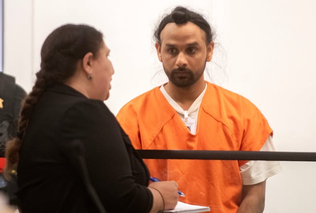 Harjinder Singh, right, listens to an interpreter translate the proceedings of his arraignment in Department 8C of the San Joaquin County courthouse in downtown Stockton on Aug. 19, 2025 on charges of killing 3 people while attempted an illegal U-turn on the Florida Turnpike near Fort Pierce, Florida.