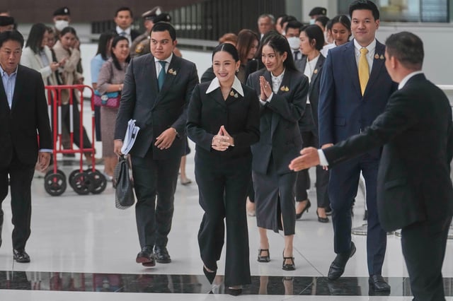 Thailand's suspended Prime Minister Paetongtarn Shinawatra, center, leaves the Constitution Court after giving testimony in Bangkok, Thailand, Thursday, Aug. 21, 2025. (AP Photo/Sakchai Lalit)