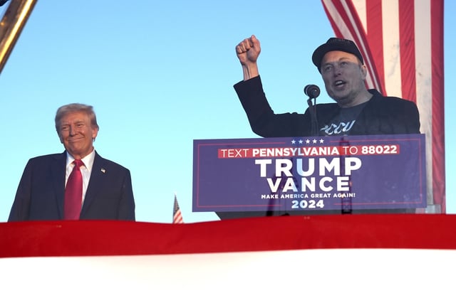 Tesla and SpaceX CEO Elon Musk speaks as Republican presidential nominee former President Donald Trump listens at a campaign event at the Butler Farm Show, Saturday, Oct. 5, 2024, in Butler, Pa. (AP Photo/Alex Brandon)